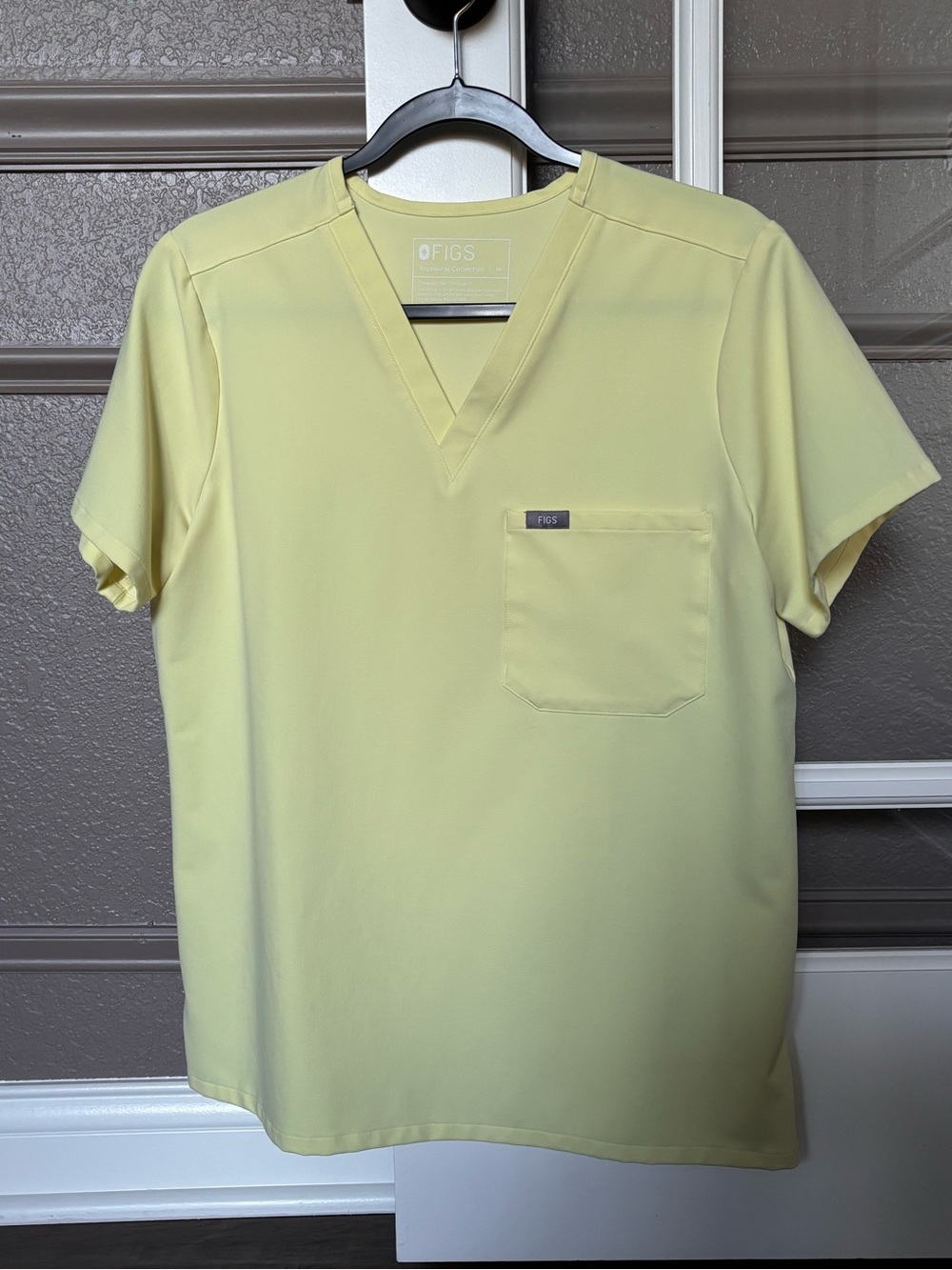 FIGS Women’s Catarina one pocket Scrub Top in Pale Yellow